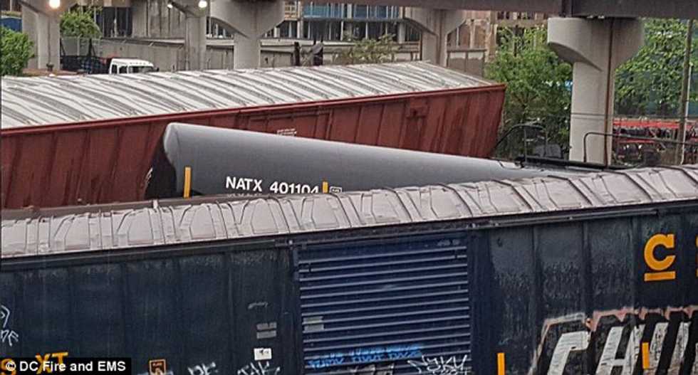 Freight train derails near Washington DC spilling hazardous liquids