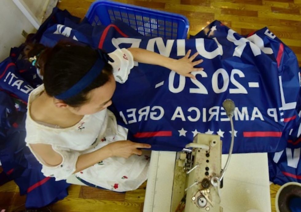 As trade war rages, Trump flags fly out of China factory