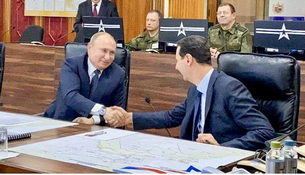WATCH: Putin and Assad caught on video laughing as they mock Trump during Damascus meeting