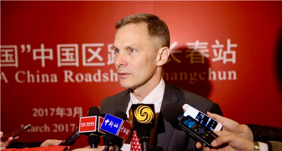 Top US diplomat in China quits over Trump climate policy