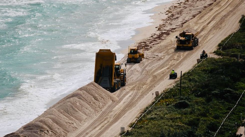 US dumps huge amounts of sand on Miami Beach to tackle climate change erosion