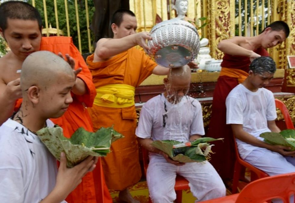 Thais rescued from cave shave heads ahead of ordination ceremony