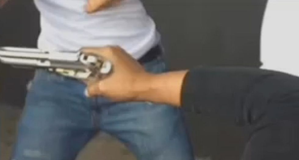 WATCH: Mom pulls gun on high school students during a schoolyard fight