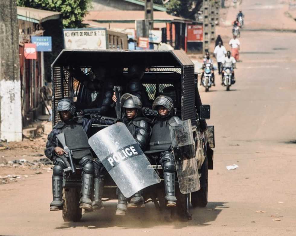 Outcry in Guinea over police using woman as 'human shield' video