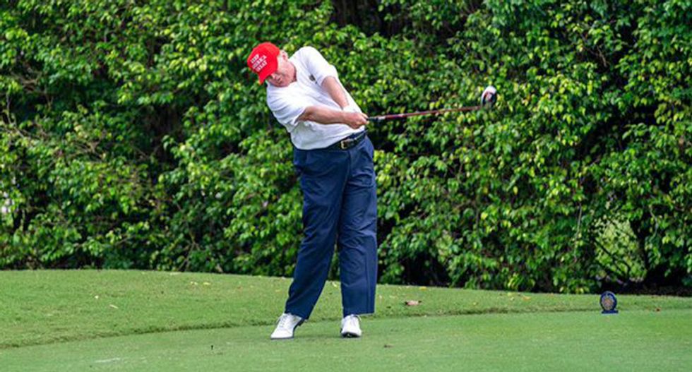 As nation mourns 100,000 dead, Trump goes golfing