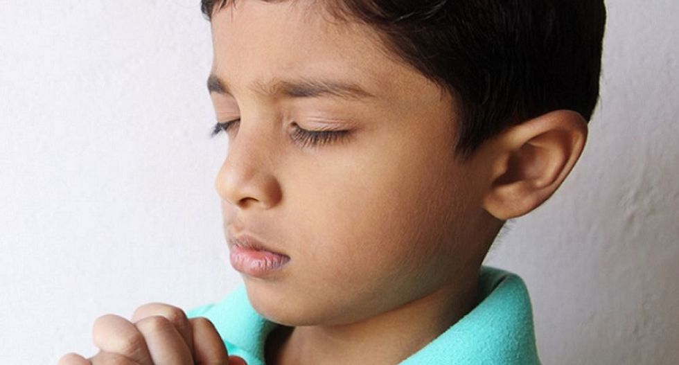 Gun safety advocates pray for NRA members holding annual meeting in Louisville