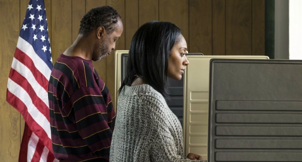 A Georgia town is sending police to black residents' homes to challenge their voting rights