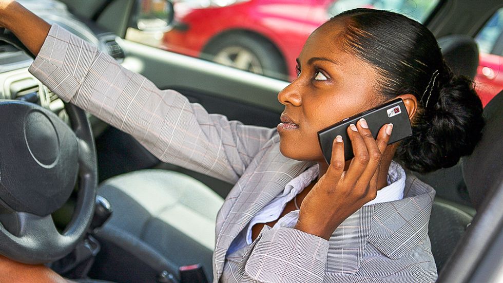 Bullets riddle Chicago woman's car -- but phone saves her life by deflecting shot to the head