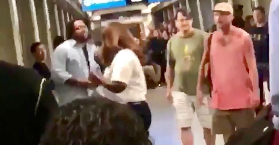 WATCH: White Chicago racist gets punched out after N-word tirade at crowd waiting for train