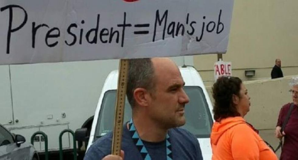 Sanders protesters rip up man’s misogynist Clinton sign that said the presidency is a 'man's job'
