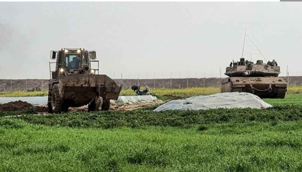 'This is a war crime': Video of IDF bulldozer dragging body of Palestinian man in Gaza sparks outrage