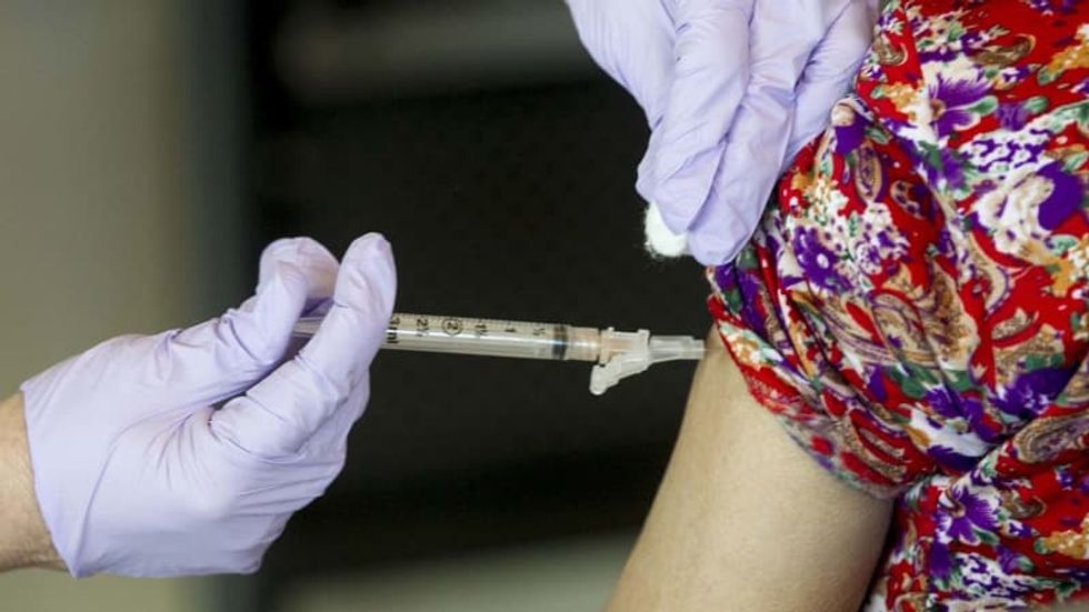 This year's flu shot has cut doctor visits for flu nearly by half: CDC