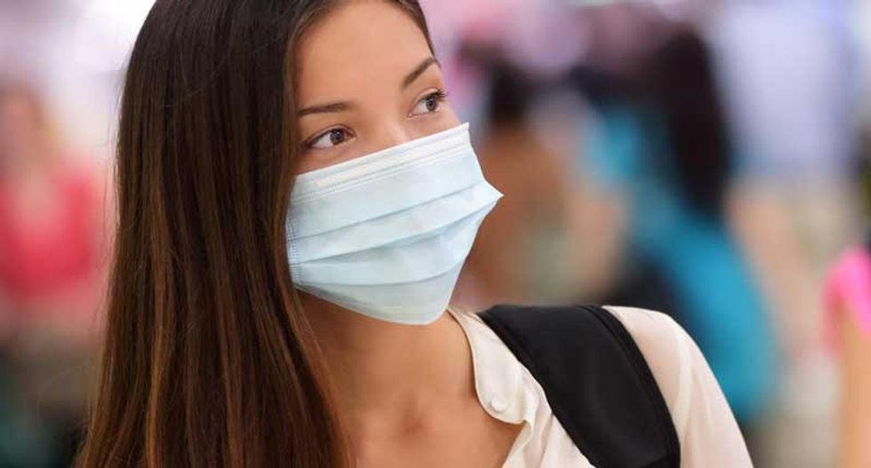 Students at Kentucky school don surgical masks to protect against school's mold problem
