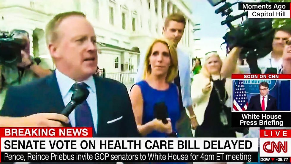 WATCH: Flustered Sean Spicer tries to flee reporters as he rushes back to the White House on foot