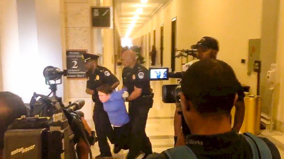 'Kill the bill, don't kill me': Police drag health care bill protesters from GOP senator's office