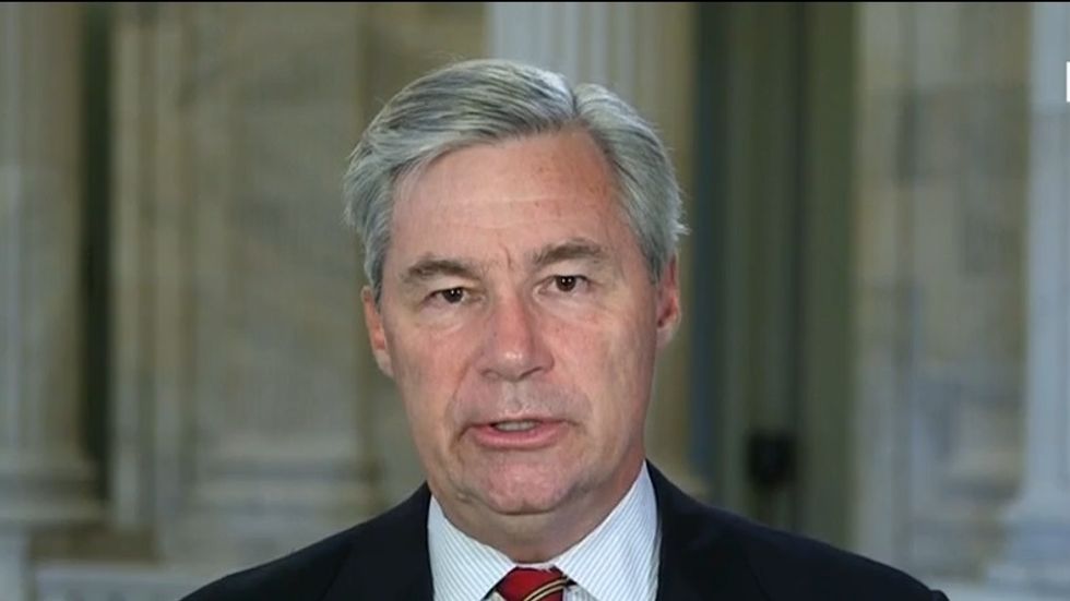 Dem senator tells CNN Trump may be 'signaling' to Putin with his 'bizarre behavior' about Russian interference