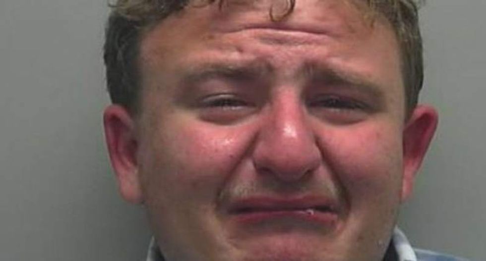 Would-be teen rapist bawls for his mugshot after threatening to assault woman in bathroom