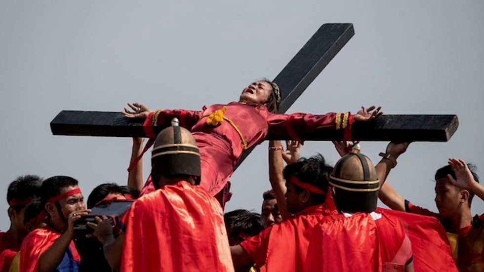 Virus-hit Philippines calls off ritual crucifixions