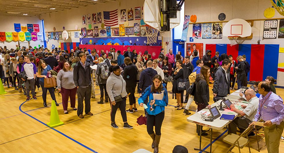Democrats sue to increase absentee ballot access in crucial swing state as pandemic rages