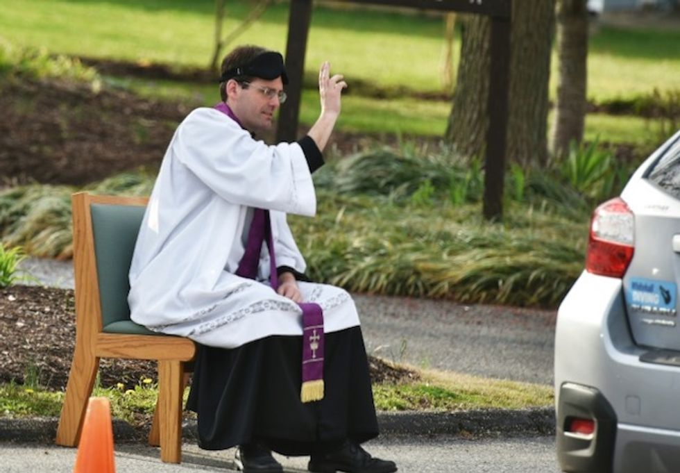 With churches closing, US priest offers drive-thru confessions