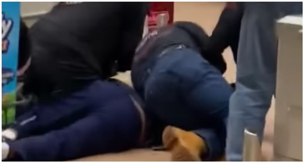 VIDEO: Wild scene unfolds as shoppers tackle and restrain man who coughed on supermarket produce