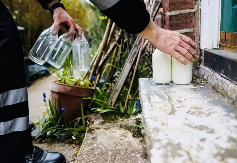 Deprived of customers, UK farmers throw away milk