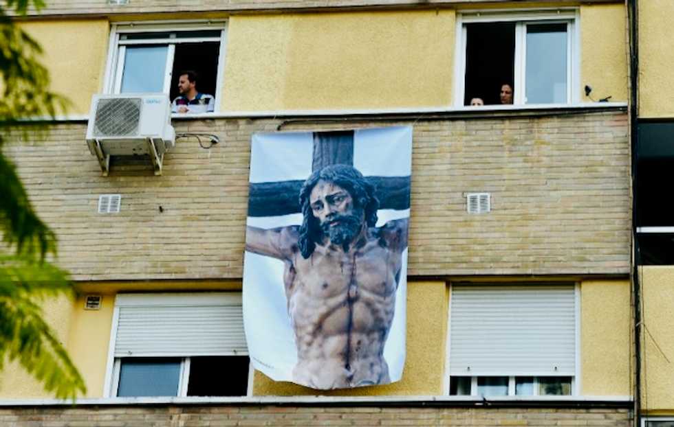 Locked-down Spain celebrates Holy Week with music and humor
