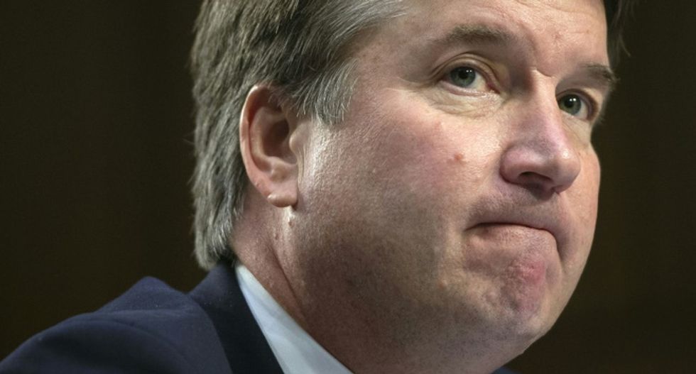 Republican-led Senate elevates controversial pick Brett Kavanaugh to the Supreme Court by the slimmest of margins