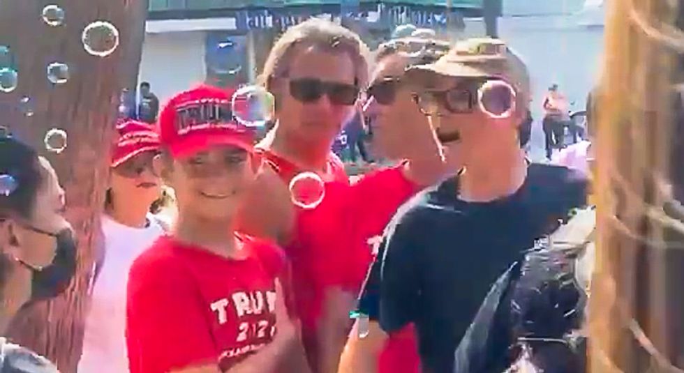 Mask-free Trump fans 'cough' on Biden supporters as president attends swanky fundraiser