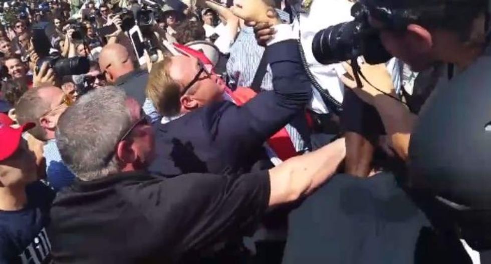 Alex Jones clashes with anti-'Nazi scum' protesters in Cleveland
