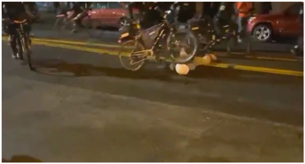 Cop caught on video rolling bicycle over protester's head is placed on administrative leave