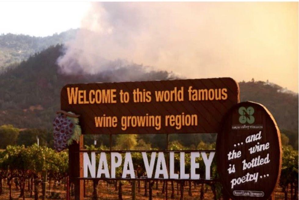 Tens of thousands flee wildfires roaring through California wine regions