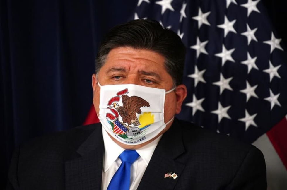 Illinois governor to isolate for a second time after another staffer tests positive for coronavirus