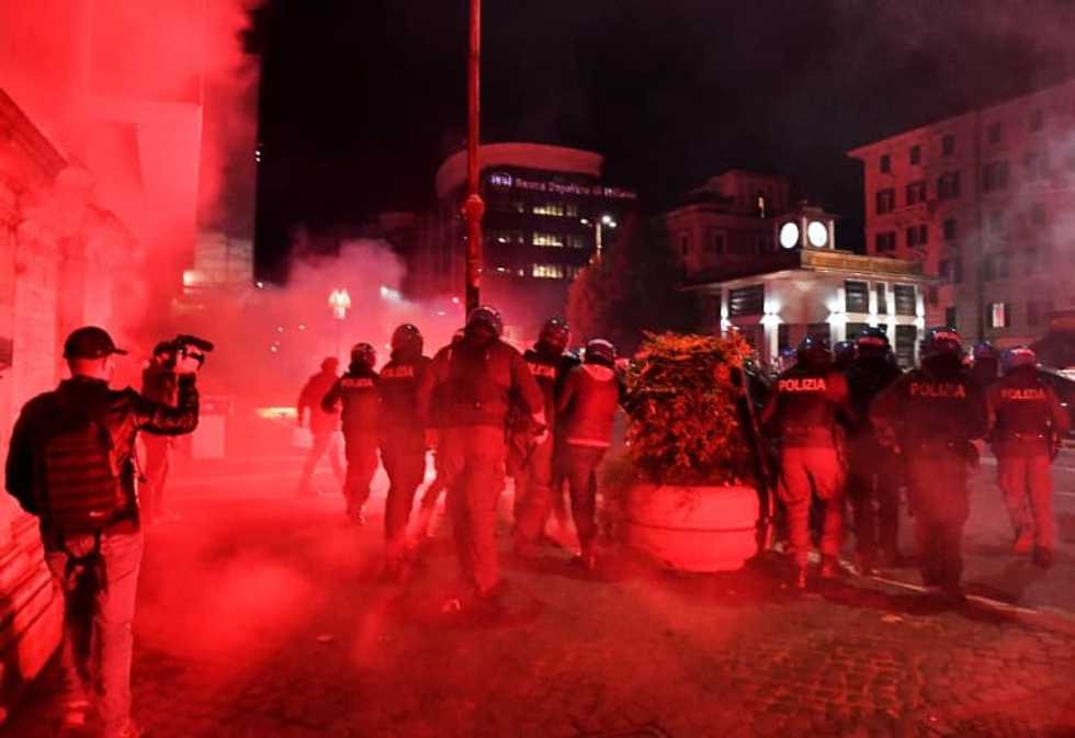 Italy protesters and police clash over virus curbs as Europe battles surges