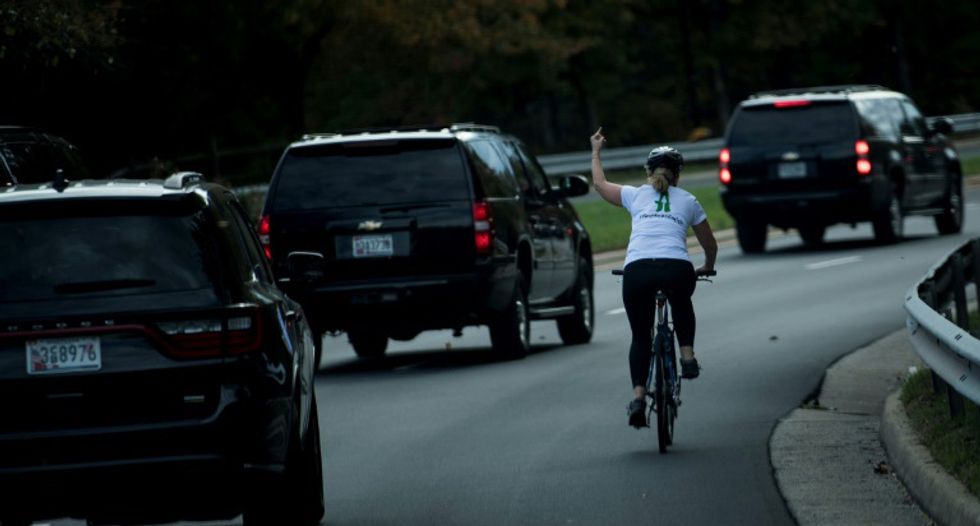 Cyclist who gave Trump the finger is showered with money