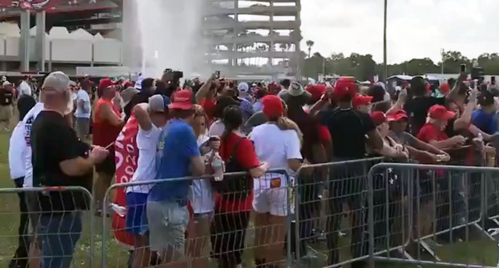 Trump supporter 'carried out on a stretcher' as heat takes its toll on Tampa rally crowd: 'Multiple people have passed out'