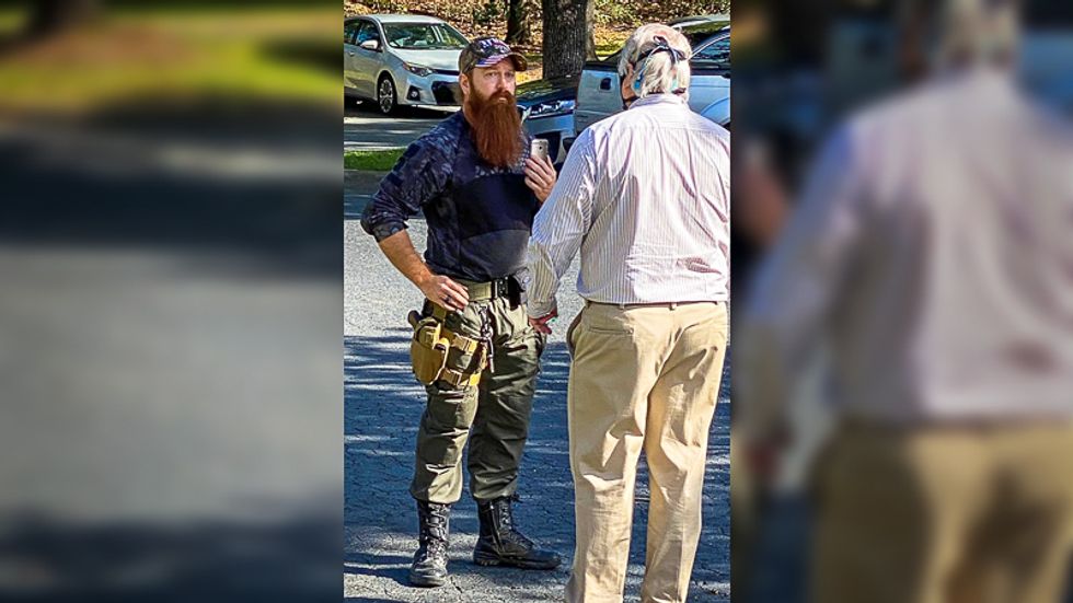 Congresswoman whisked from NC polling precinct after 'maskless white man' shows up with gun