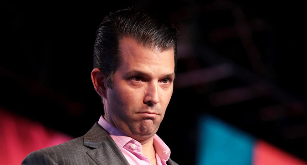Donald Trump Jr shows off an ancient 'symbol of war with Islam' as his father puts America on the warpath with Iran