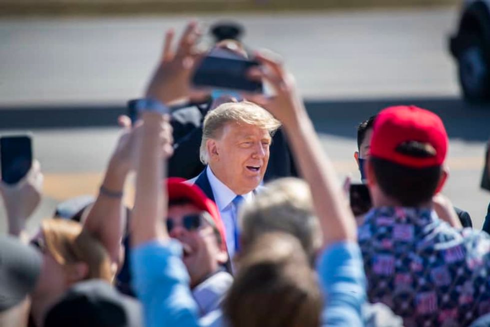 'I voted for a guy named Trump,' the president says after voting in person in Florida
