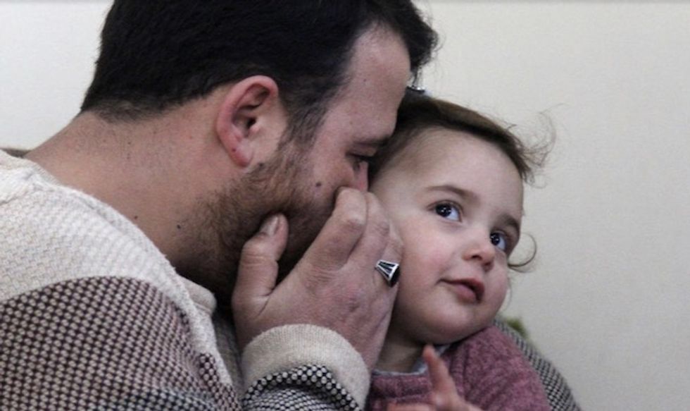 Syrian father and daughter laugh off the shelling