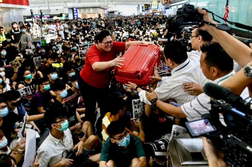 Hong Kong airport cancels departing flights for second day as protests continue