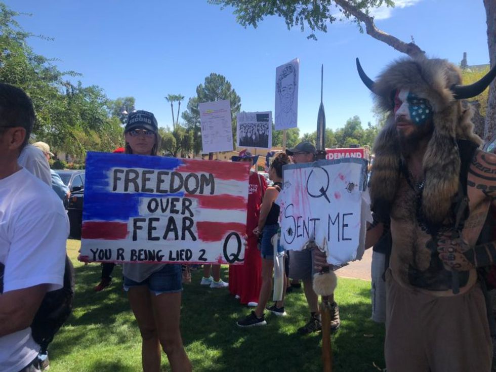 Arizona anti-mask protest also draws Confederate flag fan and flat-Earth believer