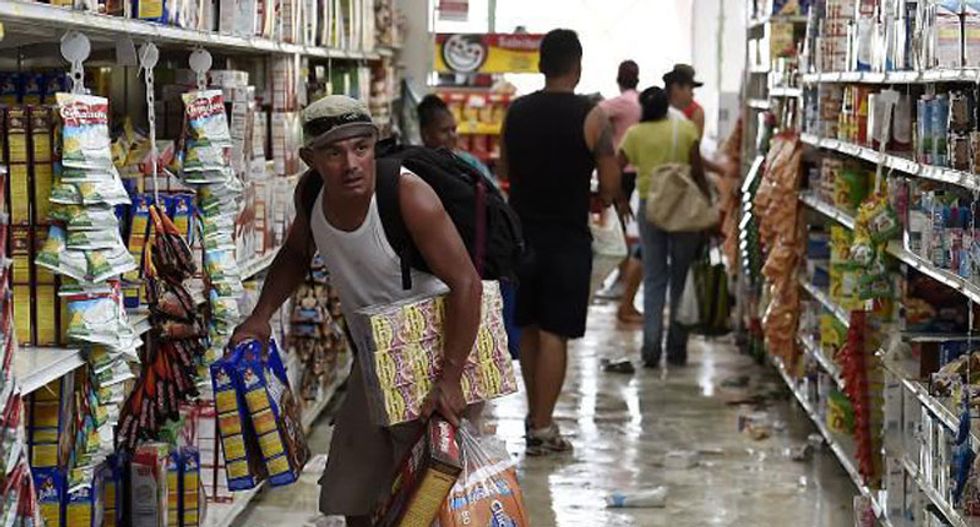 Residents grab guns to deter looters in Los Cabos, Mexico