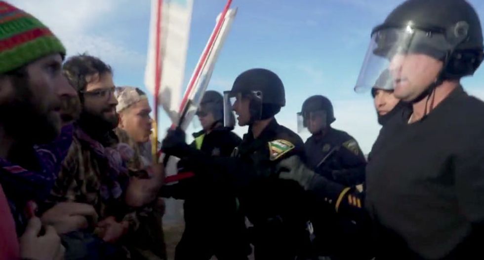 Standing Rock Dakota pipeline protesters report being held in 'dog kennel'-like pens after arrest