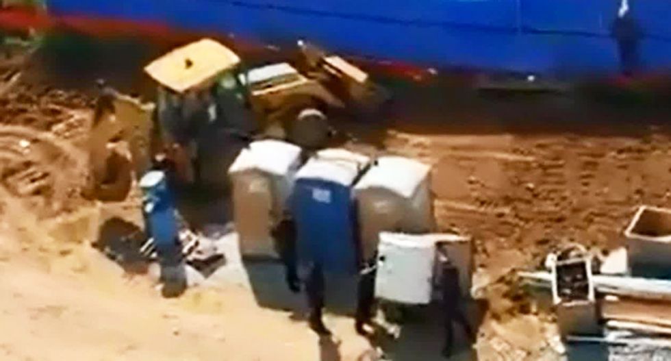 WATCH: Memphis cops tip over porta-potty to flush out suspect hiding inside