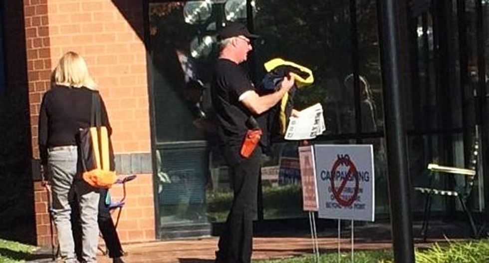 ‘Its a free country’: GOP official defends gun-packing Trump fan intimidating voters outside Virginia poll
