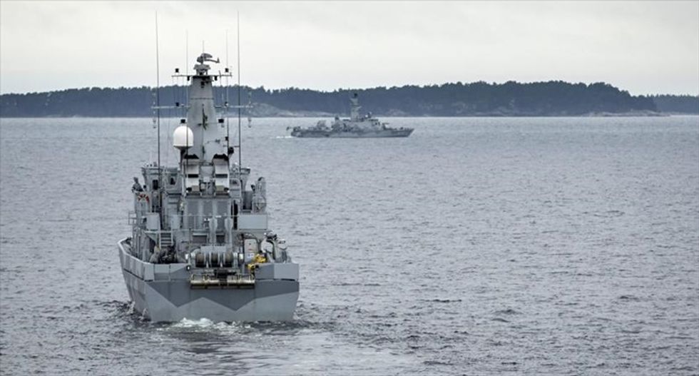 Swedish navy widens search for mystery submarine