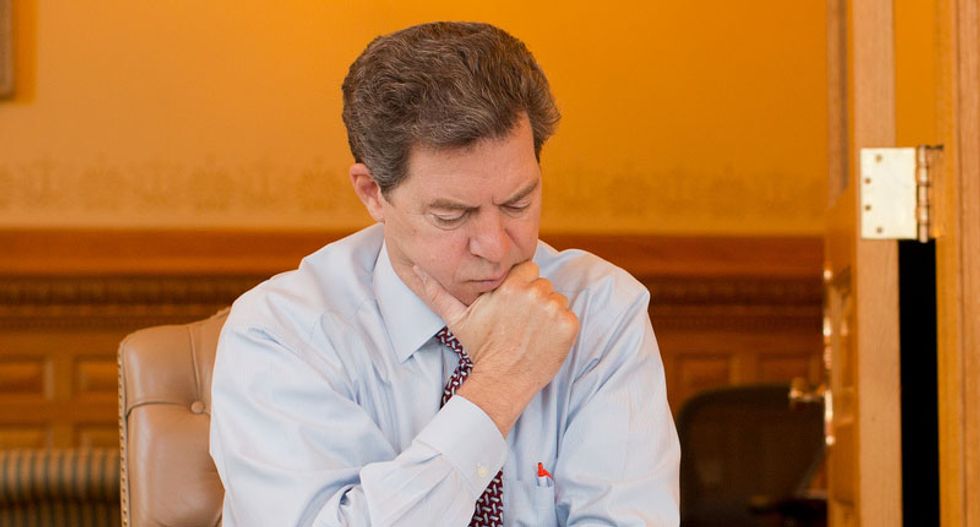 Kansas lawmakers raise state sales taxes to mend deficit Sam Brownback's tax-cut fiasco
