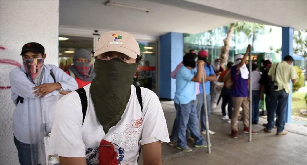 Thousands of protesters hold blockade at Mexican airport, call for missing students' return