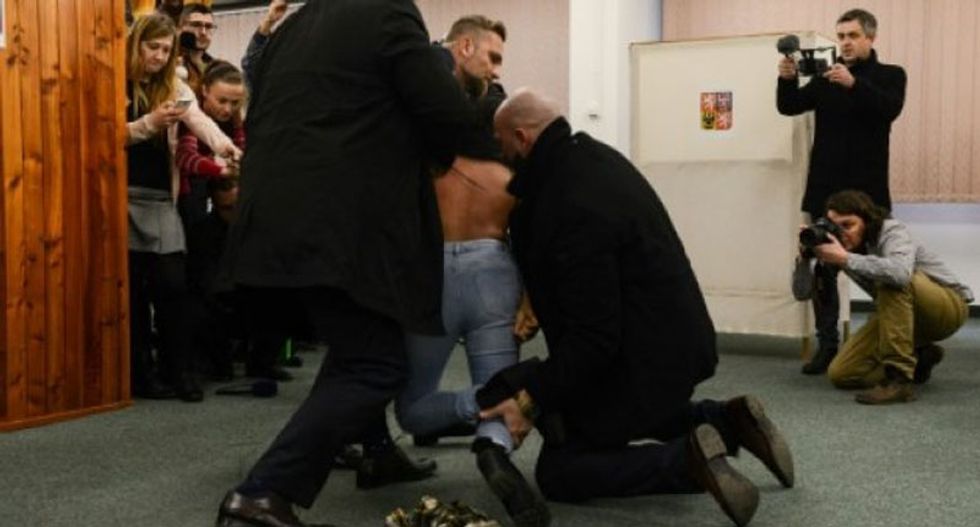 Topless woman ambushes Czech leader for being 'Putin's slut'